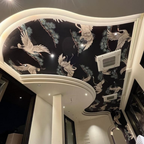 Ceiling with decorative bird pattern wallpaper