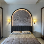 Bedroom with decorative Cherry Blossom wallpaper wall art above the bed.
